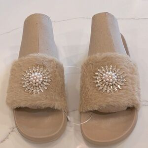 Ladies Beige Slip on Slipper with a Pearl & Rhinestones Medallion on fur. 9